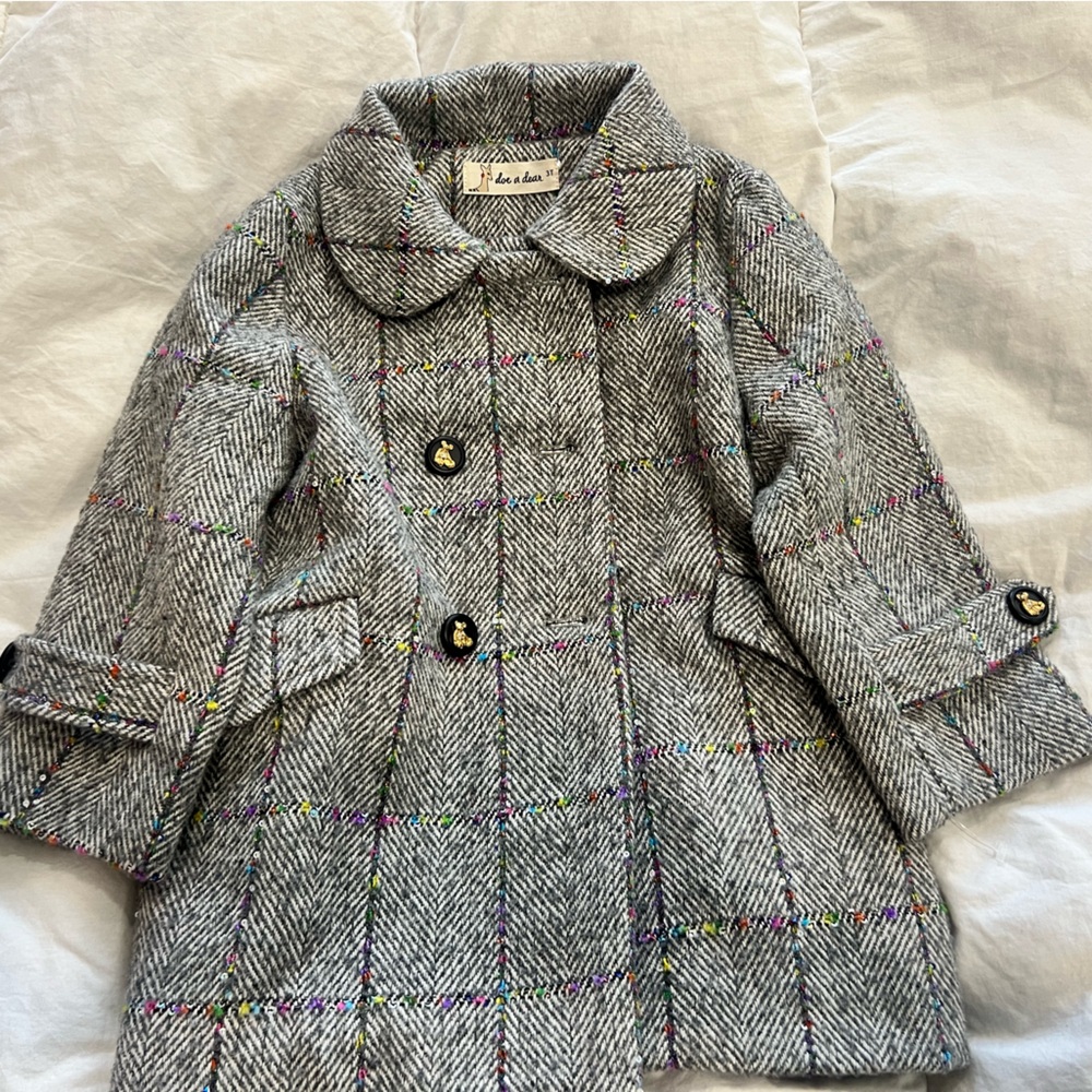 Doe a Dear Grey tweed overcoat.
